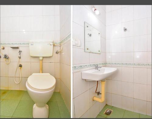 a bathroom with a toilet and a sink at HOTEL ROYAL PARK in Mangalore