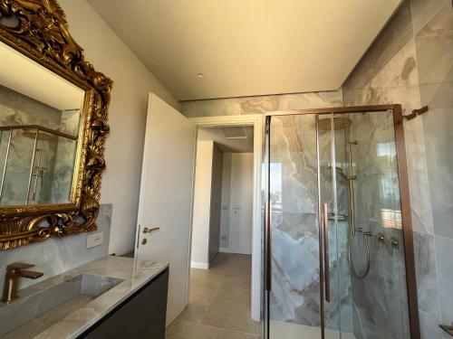 a bathroom with a shower and a mirror at 5E Villa Charme-Sea and Ortigia view-Whirlpool roof Terrace in Siracusa