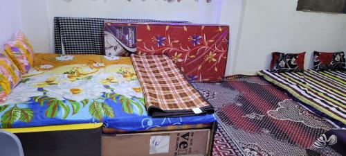 a bedroom with a bed and a box at chirayu home stay in Ujjain