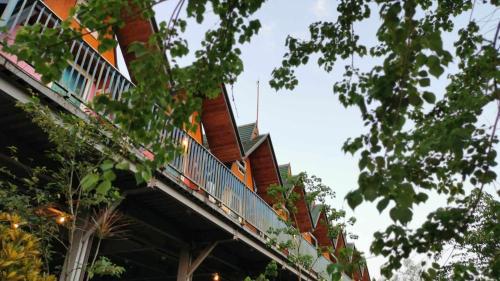 a building with a balcony on the side of it at Kitefarm in Dongshan