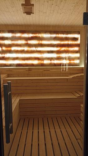 a sauna with a wooden floor and a wooden at White pearl & SPA in Veliko Gradište
