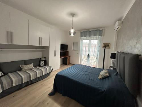 a large bedroom with a bed and a window at Lakehouse Enjoy in Verbania