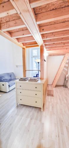 a bedroom with a bed and a dresser in a room at Your Prague Home in Prague