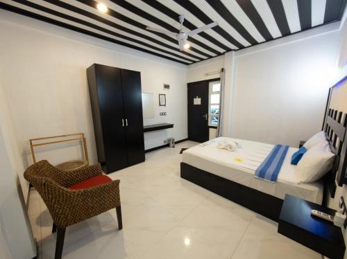 Cama o camas de una habitación en Dhonfulhafi Beach View
