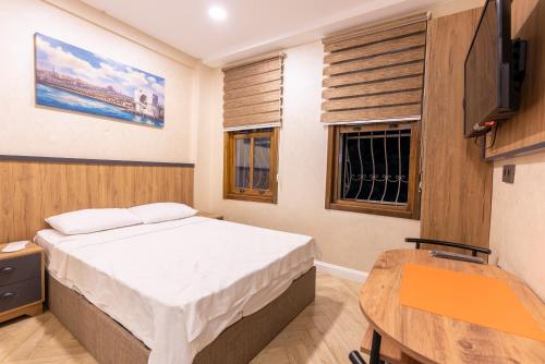TV a/nebo společenská místnost v ubytování Valens Boutique Hotel
