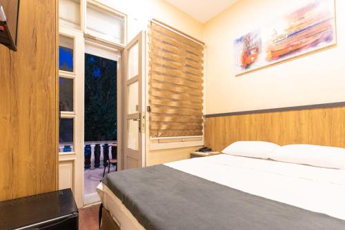 a bedroom with a bed and a window at Valens Butik Hotel, Old City Mansion in Istanbul