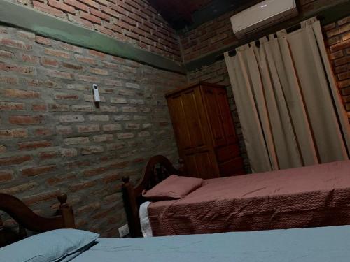 Postel nebo postele na pokoji v ubytování Cabañas las viñas full