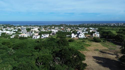 an aerial view of a town with white houses and the ocean at Sea La Vie - Holiday Home in Albion
