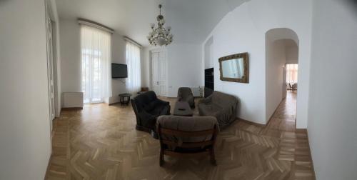 a living room with a couch and a table at Guest House - Tbilisi Center in Tbilisi City