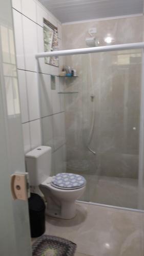 a bathroom with a shower with a toilet and a shower at BemVyver in Indaiatuba
