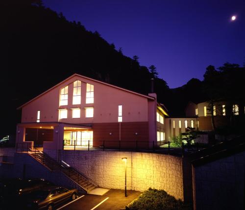 a building at night with the lights on at Hotel Daisen Shirogane in Daisen