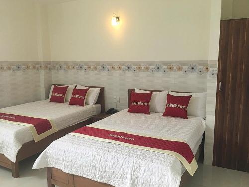 Un pat sau paturi într-o cameră la Khách sạn Khải Hoàn