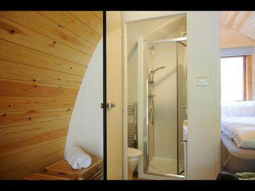 two pictures of a bathroom with a shower and a bedroom at South Kerry Glamping in Cahersiveen