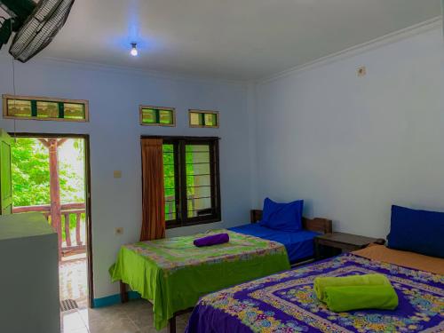 Ένα ή περισσότερα κρεβάτια σε δωμάτιο στο Breeze Hostel