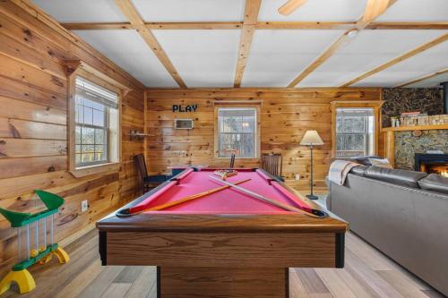 a pool table in a room with wooden walls at King Beds, Views, EasyRoads, PoolTable, Spa, Theater, Outdoor fun in Sevierville