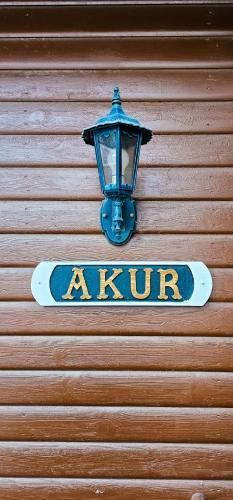 a sign on a garage door with a street light at Akureyri Cottages in Akureyri