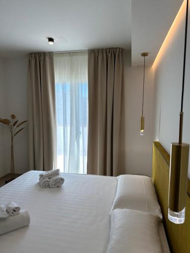 Ένα ή περισσότερα κρεβάτια σε δωμάτιο στο Amani Chic Rooms