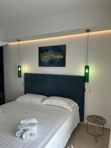 Ένα ή περισσότερα κρεβάτια σε δωμάτιο στο Amani Chic Rooms
