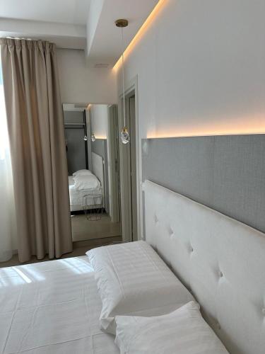 Ένα ή περισσότερα κρεβάτια σε δωμάτιο στο Amani Chic Rooms