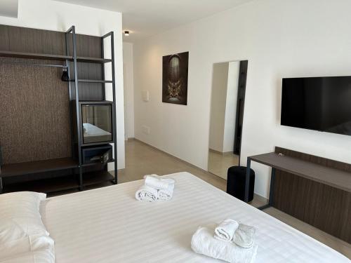 Ένα ή περισσότερα κρεβάτια σε δωμάτιο στο Amani Chic Rooms
