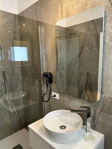 Ένα μπάνιο στο Amani Chic Rooms