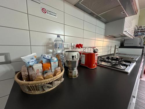 a kitchen counter with a basket of food on it at Casa Felice in Argenta