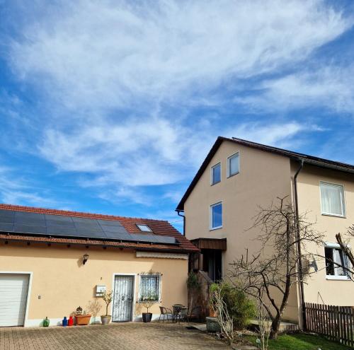a house with solar panels on the roof at Schönes Apartment / Ferienwohnung am Regen in Blaibach