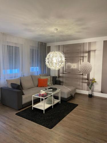a living room with a couch and a table at Time Out Apartments in Herzogenaurach