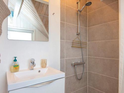 a bathroom with a sink and a shower at Holiday home Sydals IV in Neder Lysabild