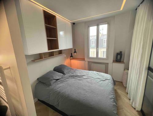 Postelja oz. postelje v sobi nastanitve Appartement Malesherbes Paris