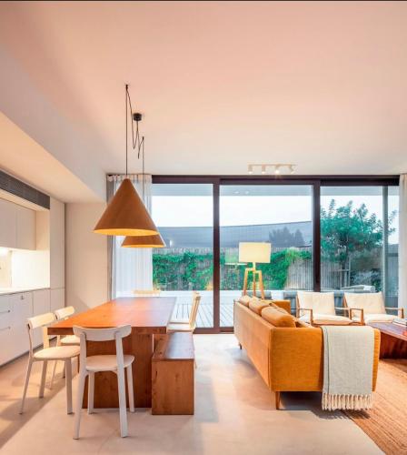 a living room with a table and a couch at Comporta.threeHouse in Brejos, Portugal in Comporta