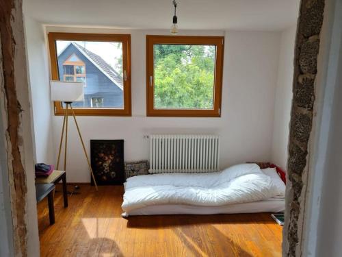 Katil atau katil-katil dalam bilik di Naturnahes Wohnen in einem alten Haus mit Garten