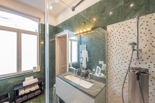 a bathroom with a sink and a shower at Euro Edens Brussels - Family Home & Free Gym Access in Brussels