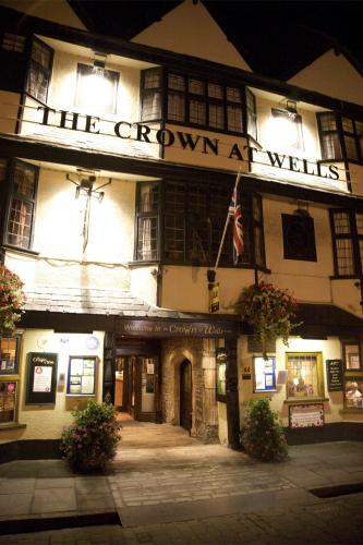 a building with a sign on the front of it at The Crown at Wells, Somerset in Wells