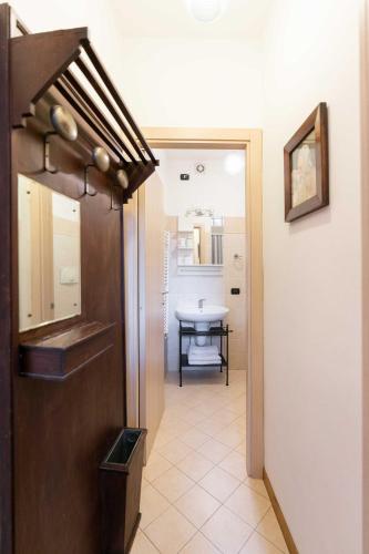 a hallway leading to a room with a table at Casa San Giacomo in Bellagio