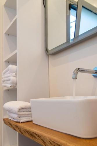 a bathroom with a sink and a mirror at VILLA KASABLANCA in Skala Rachoniou