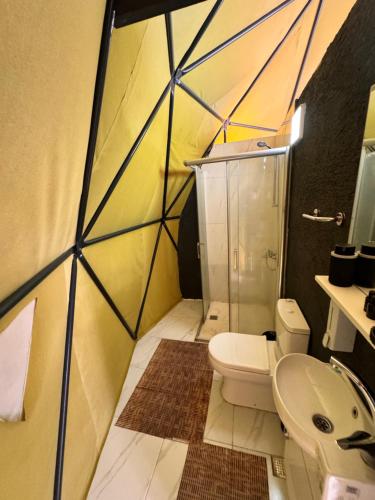 a bathroom with a shower and a toilet and a sink at ZUMBA GLAMPİNG SAPANCA in Sapanca