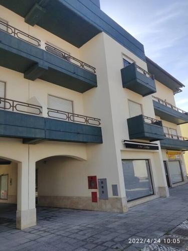 a building with balconies on the side of it at Gala T1+ in Figueira da Foz