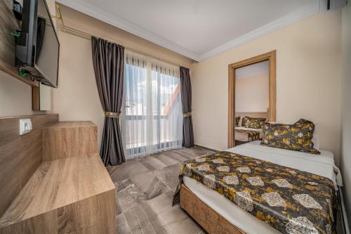 Postel nebo postele na pokoji v ubytování Arsi Paradise Beach Hotel