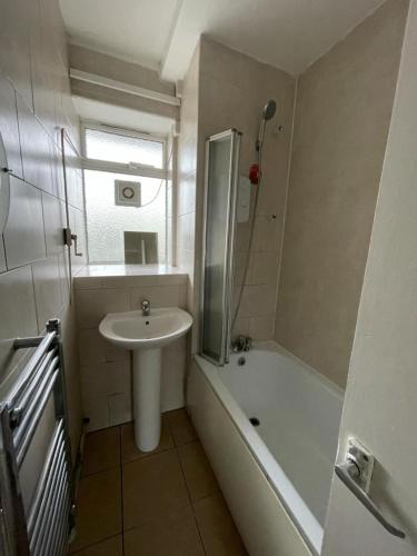 a bathroom with a sink and a shower and a sink at Private rooms with shared facilities in Camden Town in London