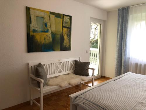 a bedroom with a white bed and a window at feelslikehome Apartment Nähe Stuttgart Flughafen - Messe in Filderstadt