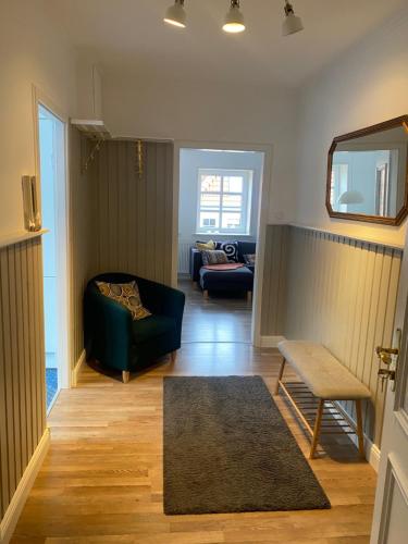 a living room with a couch and a chair at Ferienwohnung am Kalkberg in Bad Segeberg