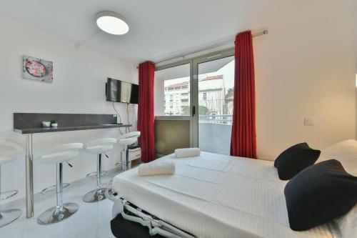 a hospital room with a bed and a window at Stylish 2 rooms in the heart of Cannes in Cannes