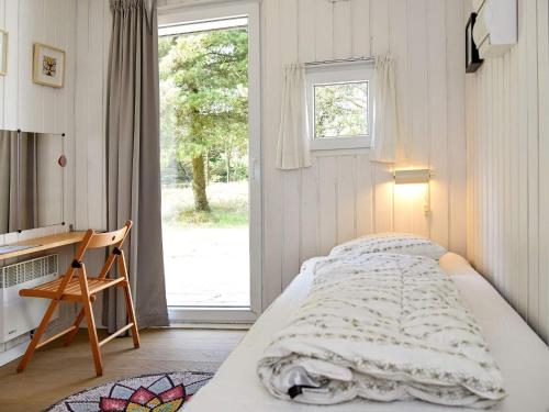 Ένα ή περισσότερα κρεβάτια σε δωμάτιο στο 12 person holiday home in Fanø-By Traum