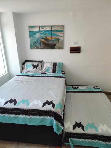 a bedroom with a bed with stars on it at Sanbar House in San Bartolo