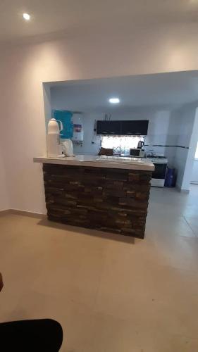 a kitchen with a counter in a room at Apart Santa Elena in Santa Elena