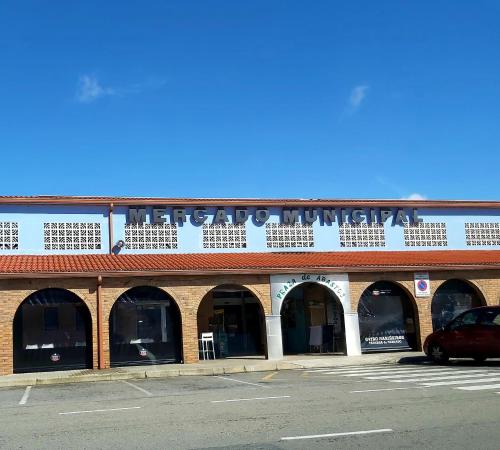 a building with a sign on top of it at Novama in O Grove