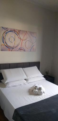 En eller flere senge i et værelse på Casa Do Roger Hospedagem