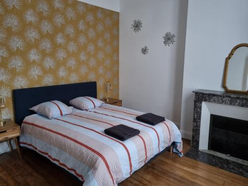 Кровать или кровати в номере Maison de charme - accès autonome