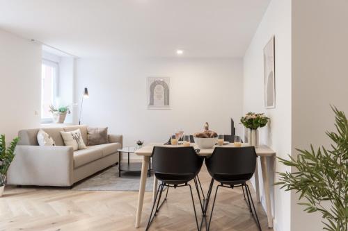 a living room with a table and a couch at living TIMELESS - Adler Apartments Sasbachwalden in Sasbachwalden